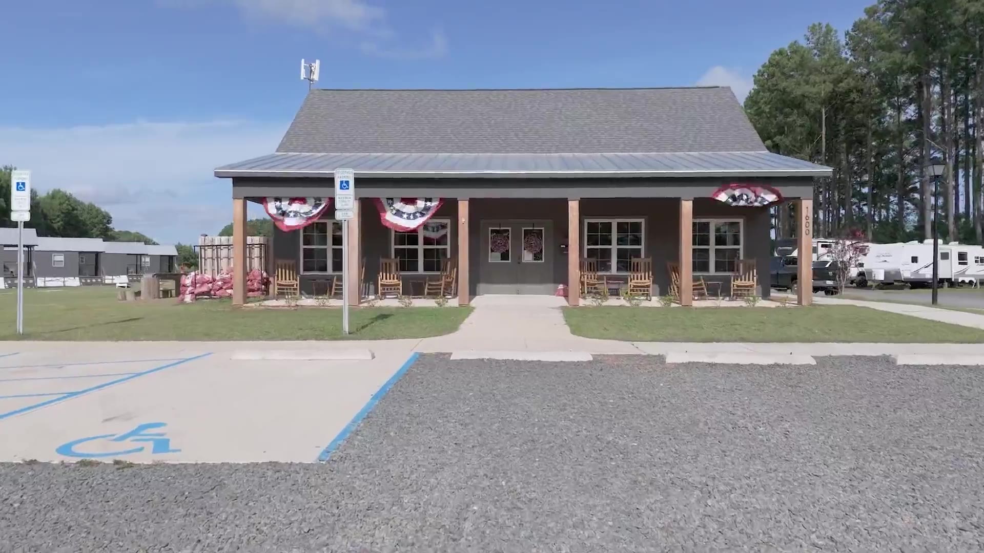 The camp store and front office at In The Pines RV and Cabin Village in Bolivia, North Carolina, with the RV sites behind