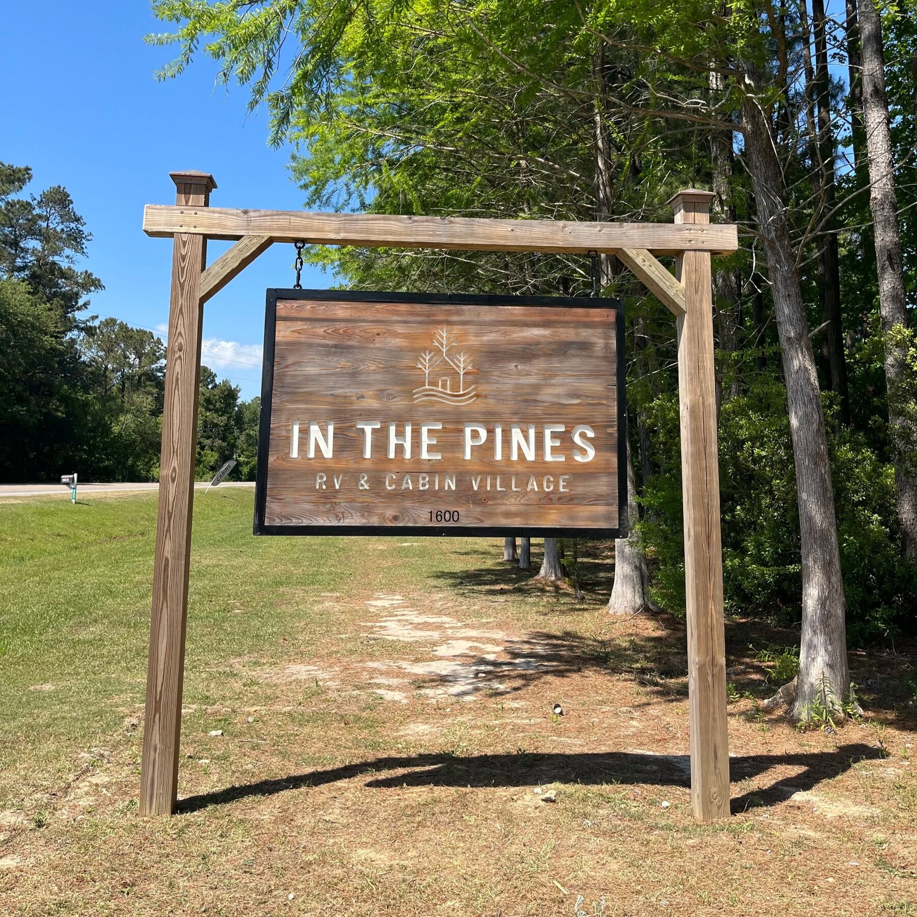 The In The Pines entrance sign on George II Hwy SE, Bolivia NC, where our terms and conditions begin at the gate