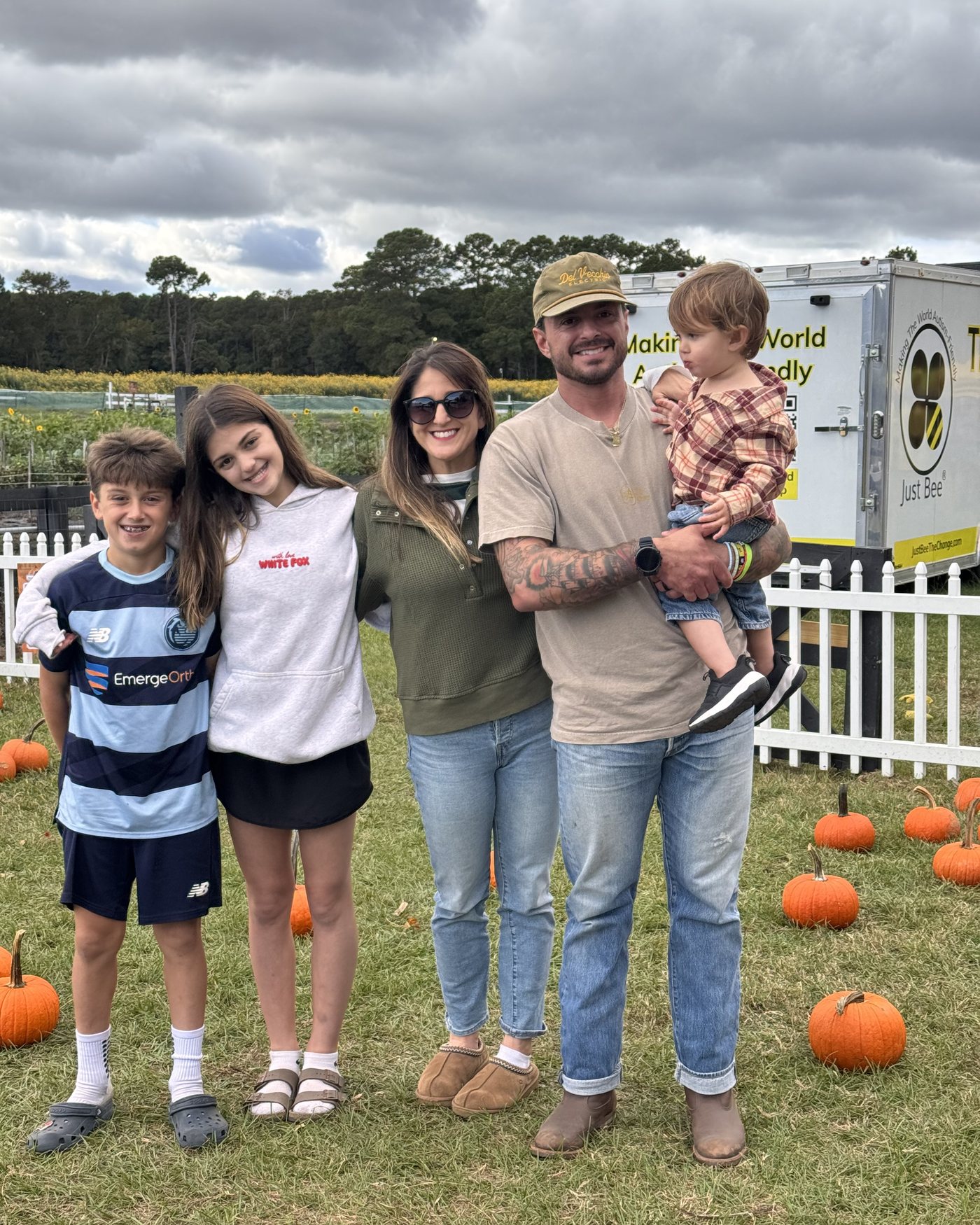 Kelley and Joe Del Vecchio with their children at a pumpkin patch