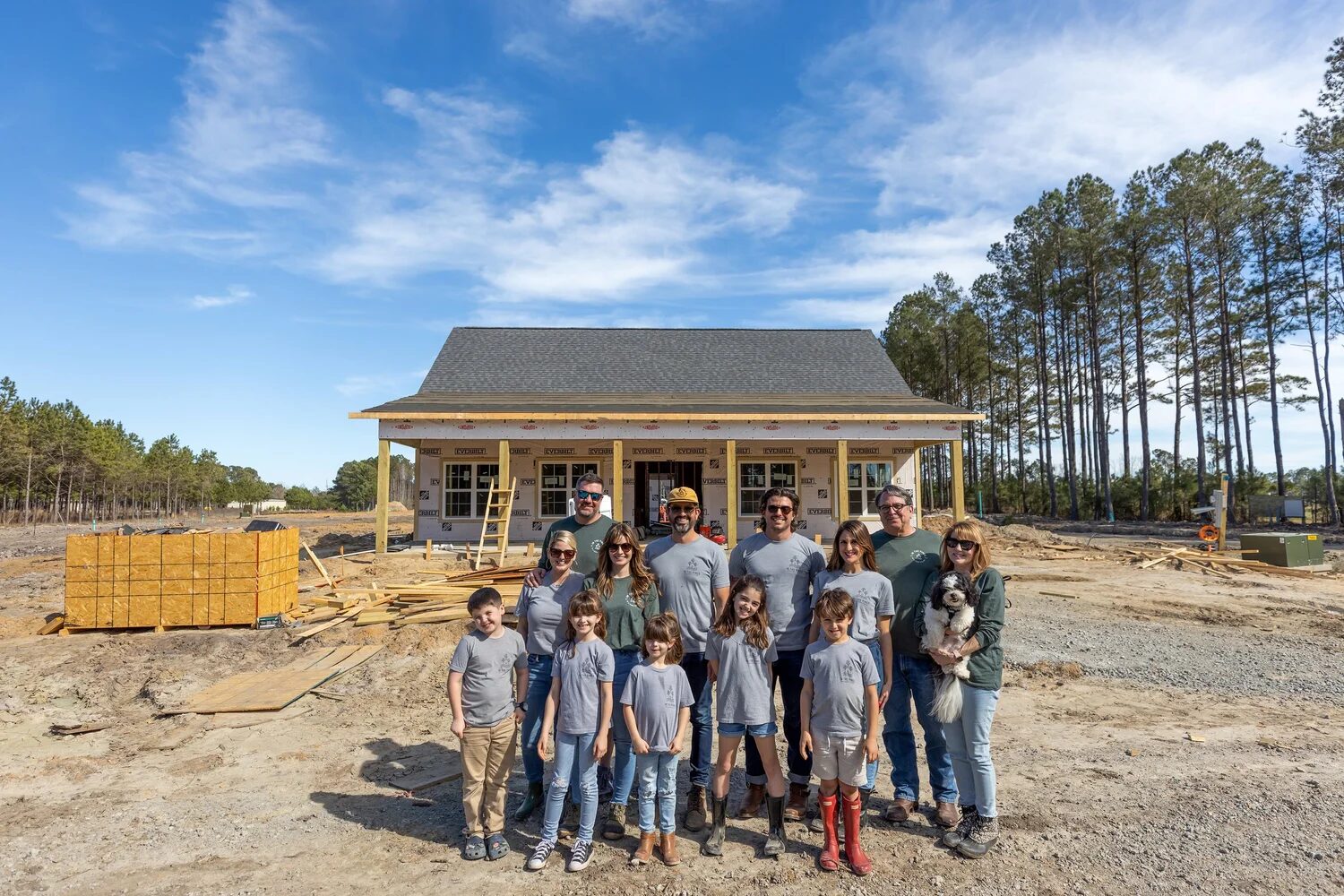 The whole Judge family in front of the camp store while it was under construction