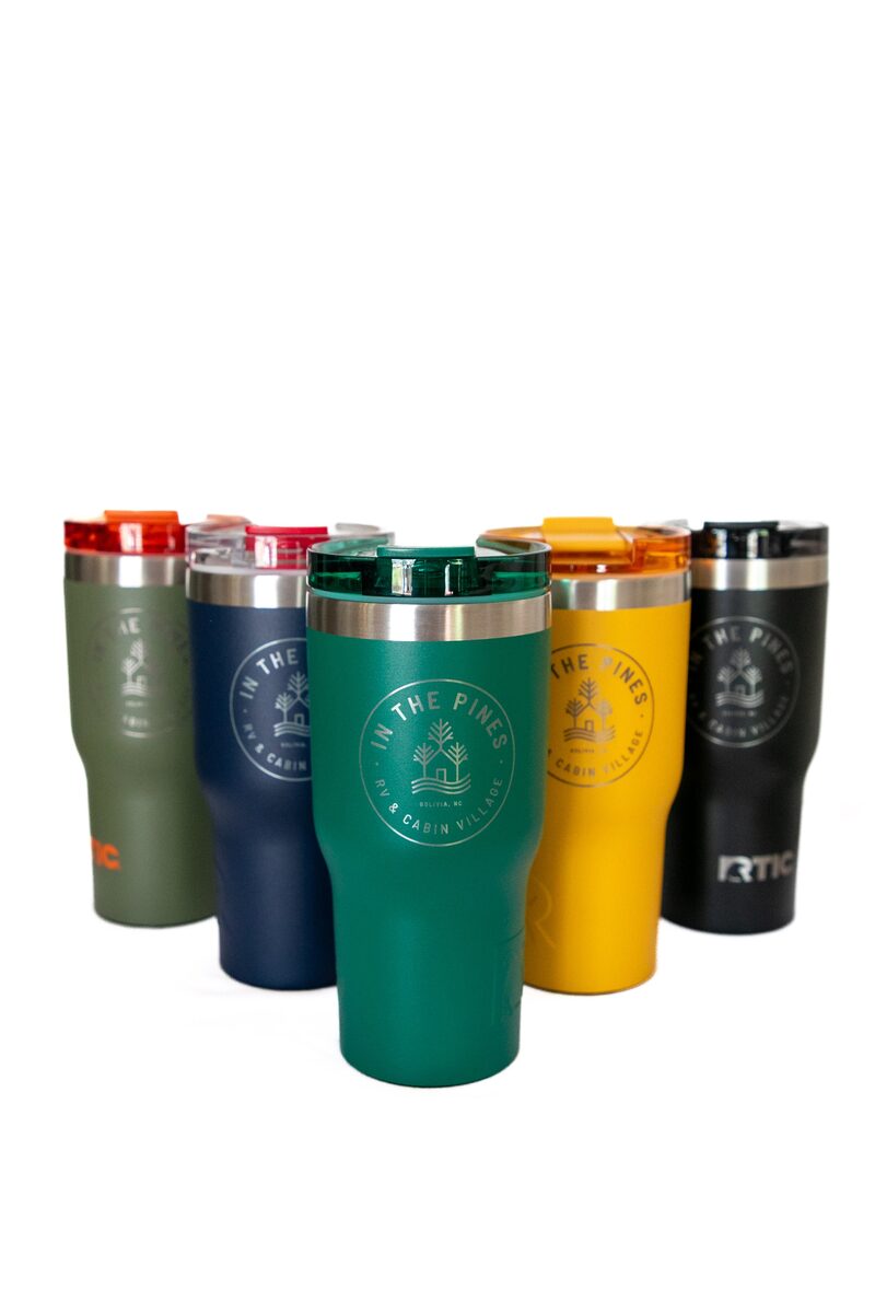 A row of In The Pines insulated tumblers in several colors